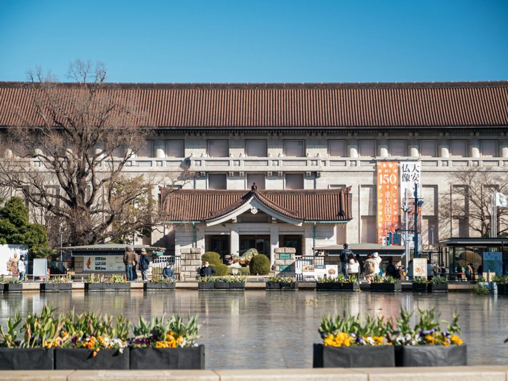 a building with a pond in front of it